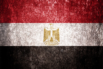 Close up of grunge Egypt flag. Dirty Egypt flag on metal surface.