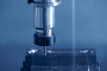 Closeup CNC milling machine during operation. Produced cutting metal parts, banner background of industry heavy factory