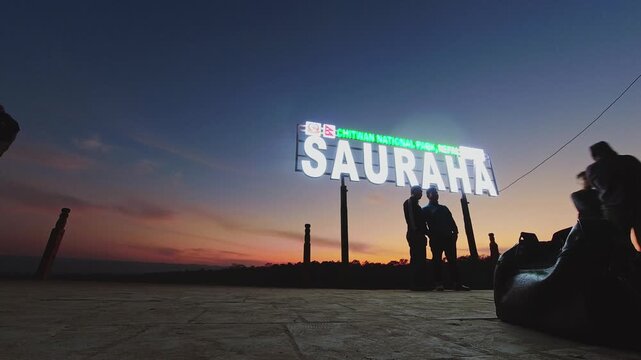 Sauraha, Nepal - 25th november , 2023: Beautiful time lapse sunset panorama over Rapti river in Sauraha. Tourist visit Chitwan tropical jungles scenery popular sunset viewpoint in Chitwana, Nepal
