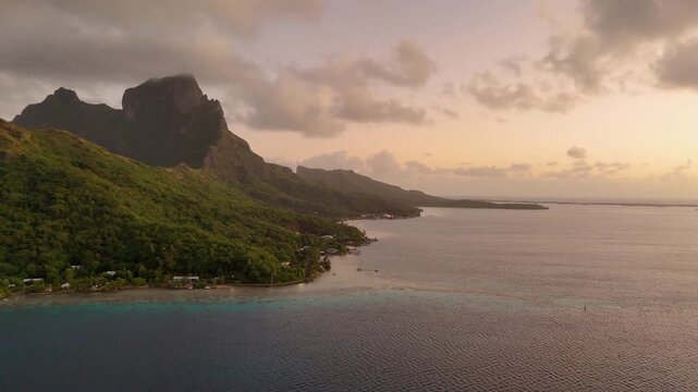 Aerial view of Araarapupu point and Mount Otemanu during sunrise over tropical island Bora Bora. Aerial drone view. 