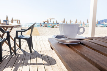 Empty Chairs and Table on Beachside Deck