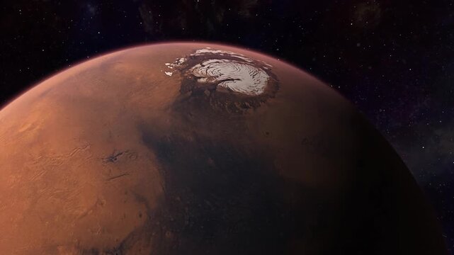 Moving over planet Mars' north pole revealing it polar ice caps, and a glowing atmosphere over a star background.