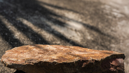 Rock, Stone podium stand display advertising product with shadow leaves light wall background well free space for text