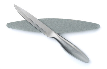 Top view of kitchen knife and whetstone