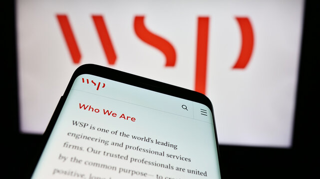 Stuttgart, Germany - 07-21-2024: Mobile phone with website of Canadian consulting company WSP Global Inc. in front of business logo. Focus on top-left of phone display.