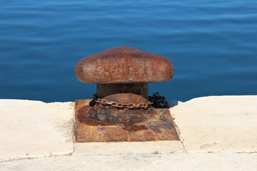 Bollard with a mooring line wrapped around it