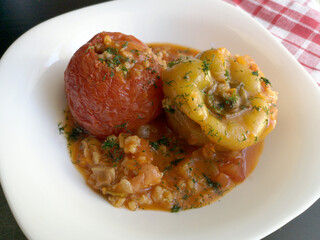 Stuffed pepper and tomato