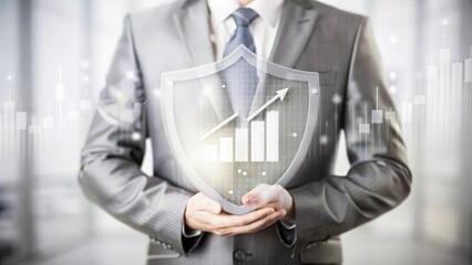 Insurance Coverage and Risk Management – Image of a businessman holding a shield with financial charts and data in the background, symbolizing insurance and risk management.
