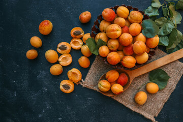 Wooden spoon with apricots, concept of harvest and summer preserves
