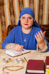 A Jewish woman at the table gives Torah lessons to women