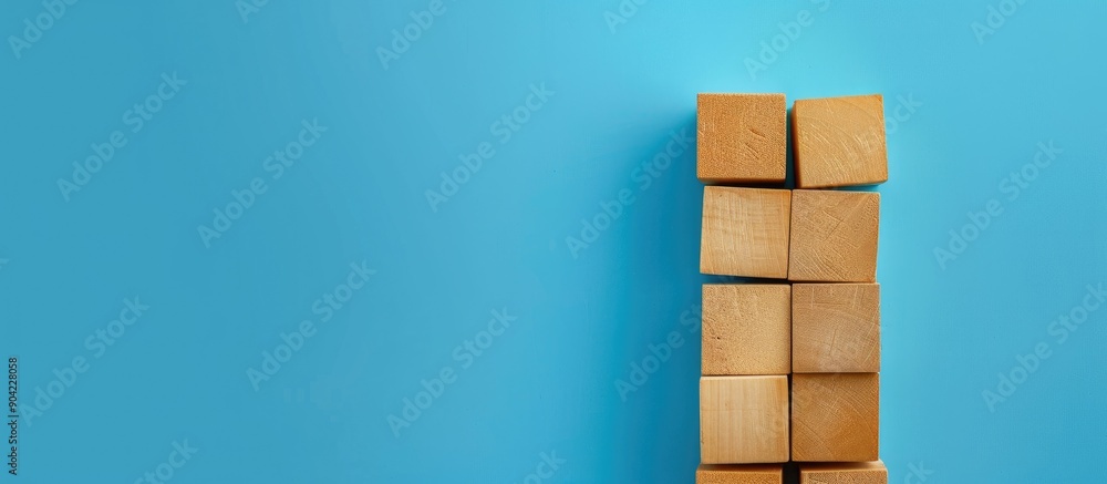 Aufkleber wooden blocks with personal growth message on blue background serving as a symbolic copy space image