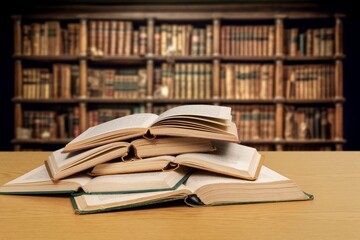 pile of reading books on table in student's library