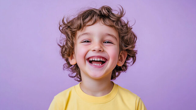 Cheerful boy against a soft lilac background