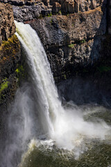 powerful Palouse Falls flowing from the basalt canyon to the Snake River in eastern Washington