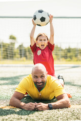 Fototapeta premium soccer, sport with a dad and daughter training on a court outside for leisure fitness and fun