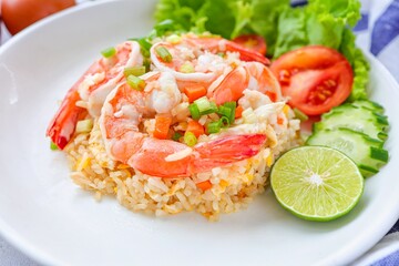 Fried rice with shrimps on a white plate