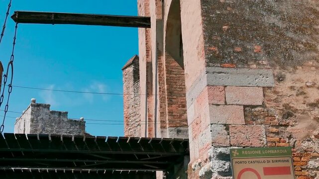 fortress castle of Sirmione seen from the boat on Lake Garda. High quality 4k footage