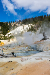 dramatic volcanic landscape of hot steams and sulfur laden pools, hydrothermal area  in Bumpass Hell in Lassen National Park.