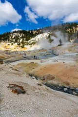 dramatic volcanic landscape of hot steams and sulfur laden pools, hydrothermal area  in Bumpass Hell in Lassen National Park.