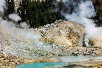 dramatic volcanic landscape of hot steams and sulfur laden pools, hydrothermal area  in Bumpass...