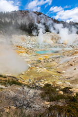 dramatic volcanic landscape of hot steams and sulfur laden pools, hydrothermal area  in Bumpass Hell in Lassen National Park.