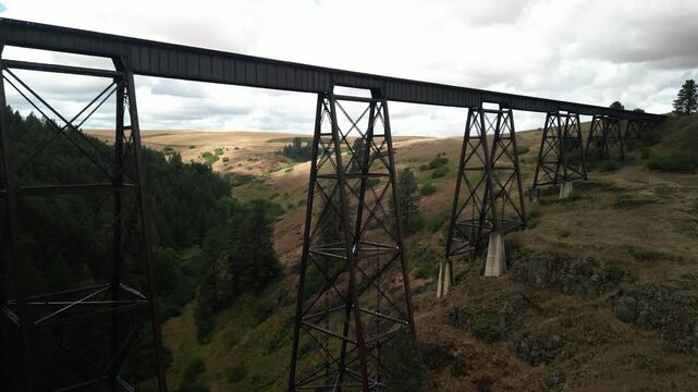 Aerial along Camas Prairie Railroad old train trestle in Grangeville Idaho