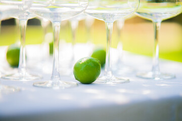 glasses of champagne near a lime