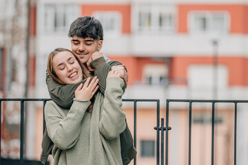 wedding couple hugging on the street