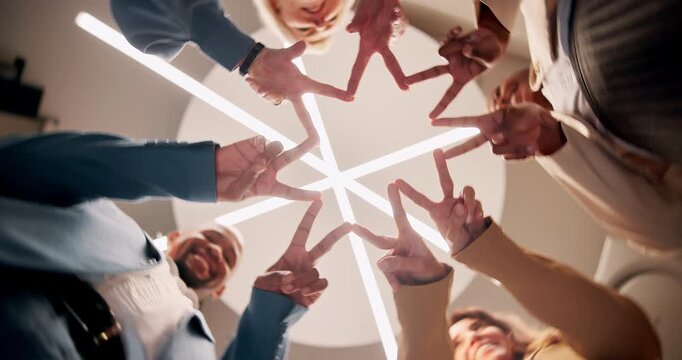 Business people, finger and star in circle at office with low angle for team building, collaboration and strategic alignment. Group, diversity and hands together with peace sign for synergy and trust