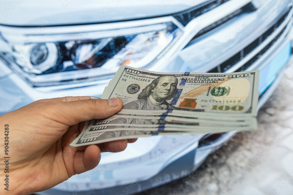 Canvas Prints business man holding money against new ecar at showroom. concept of insurance, loan buying car