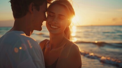 Fototapeta premium Young couple in love, man and woman together on sea sand beach, hugging and smiling at sunset, portrait. Girlfriend boyfriend