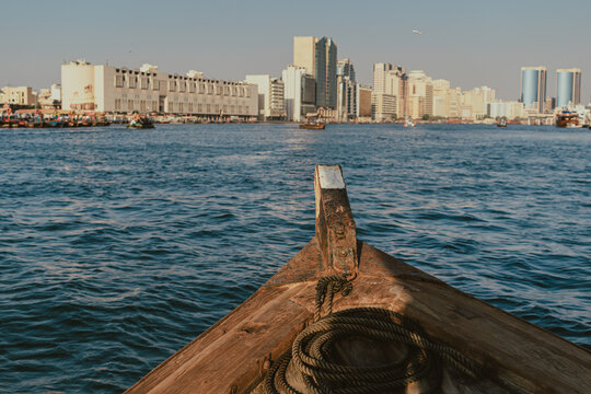 Dubai, UAE - October 5, 2020: Dubai Creek skyline and waterfront view from traditional abra boat in Deira district Old Dubai
