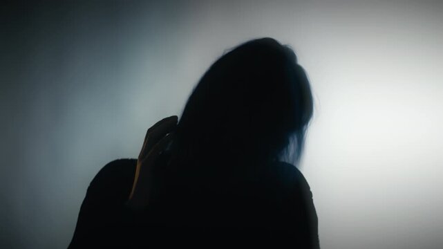 Creepy insane woman writhing in convulsions, personality disorder, obsession