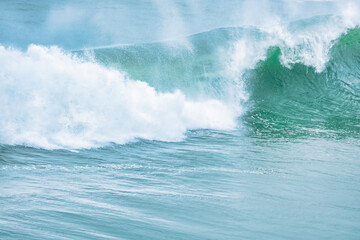 Wave splashing close-up. Crystal clear sea water, in the ocean in San Francisco Bay, blue water, pastel colors.