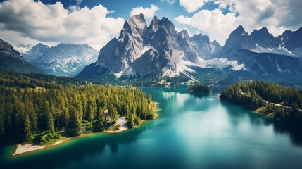 Fototapeta premium Aerial view of lago antorno surrounded by majestic dolomites and alpine peaks in misurina near cortina d'ampezzo, italy - tranquil lake mountain landscape
