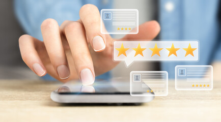 hand clicks on smartphone screen, rating quality on five-star system