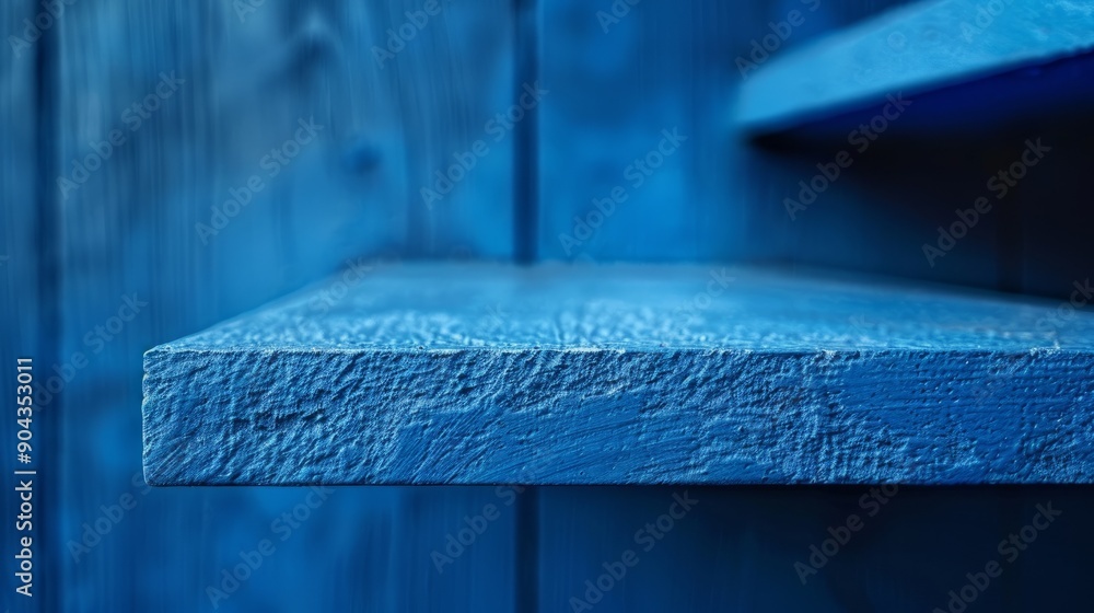 Poster close-up of a blue shelf displaying texture and color in a bright setting