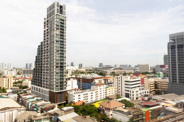 Fototapeta premium Tall structures in a large metropolis Large metropolis by day, panoramic picture of the city