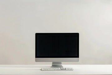 Fototapeta premium Minimalist work desk with modern computer and keyboard