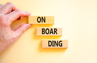 Onboarding success symbol. Concept word Onboarding on wooden blocks. Businessman hand. Beautiful white background. Business onboarding success concept. Copy space.