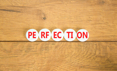 Perfection symbol. Concept word Perfection on beautiful white pill. Beautiful wooden background. Business perfection concept. Copy space.