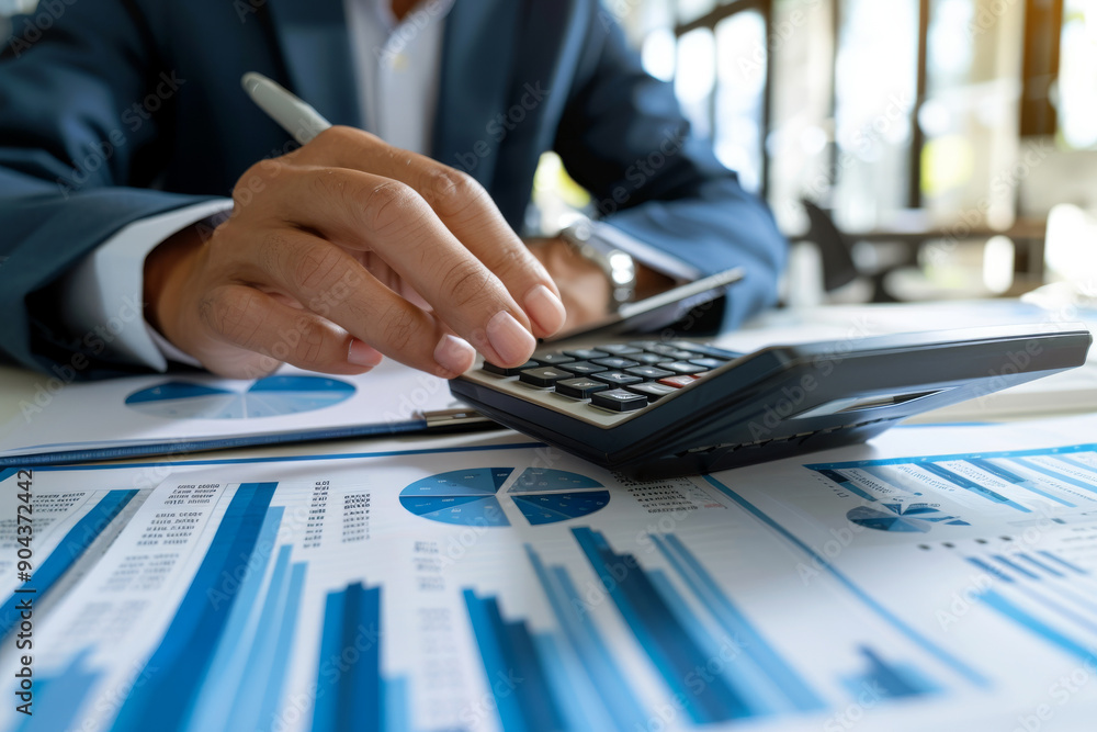 Poster businessperson is using a calculator to add numbers on a paperwork