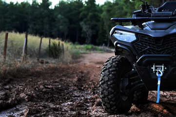 Driving in the forest and mud with an ATV