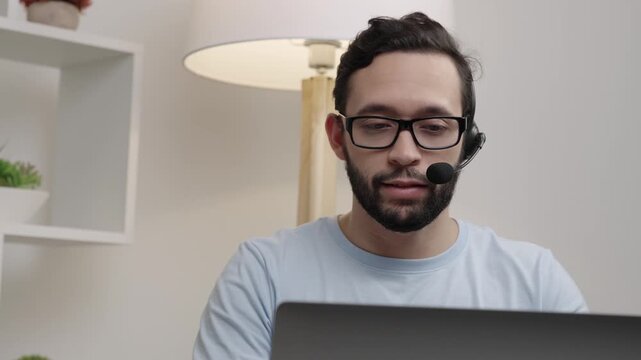 Man speaking on a videoconference using a microphone