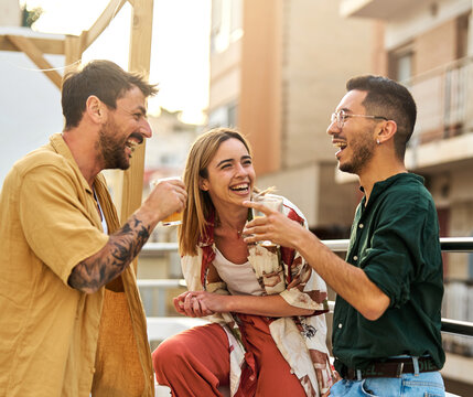 woman man rooftop friend youth young party friendship talking fun happy outdoor group drink lifestyle summer together terrace leisure