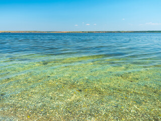 sea view in summer day with transparent water and blue sky with copy space