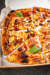 pizza chicken meat, sausages, olives, cheese, tomato sauce.fresh meal food snack on the table copy space food background rustic top view