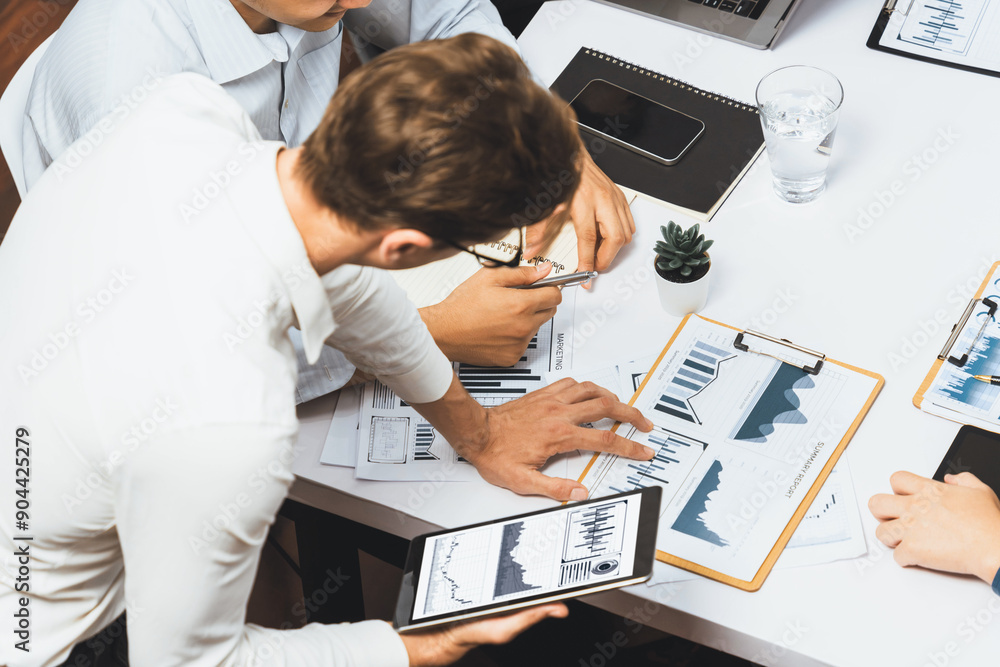 Fototapete analyst team uses bi fintech display tablet to analyze financial data . business people analyze bi s