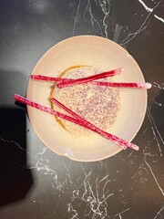 Beetroot meringue with black sesame powder at StreetXO