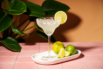 Margarita, traditional alcohol cocktail with lime, tequila, ice cubes and sea salt.